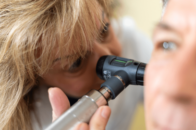 woman using an otoscope