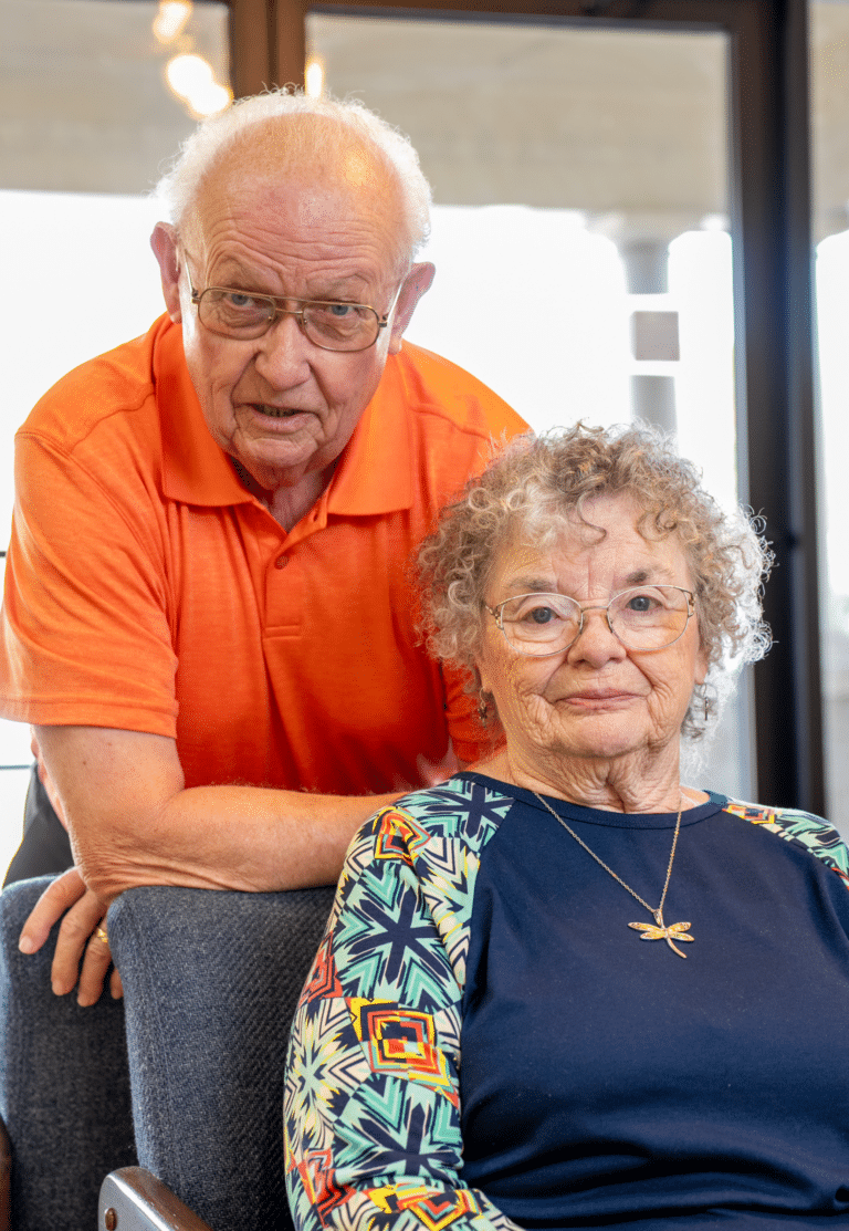 Older couple in lobby.