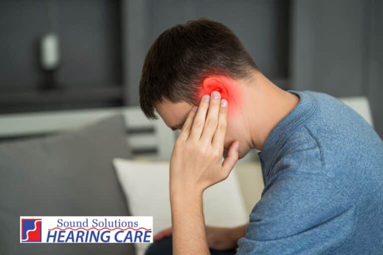 man with glowing red ear because of tinnitus