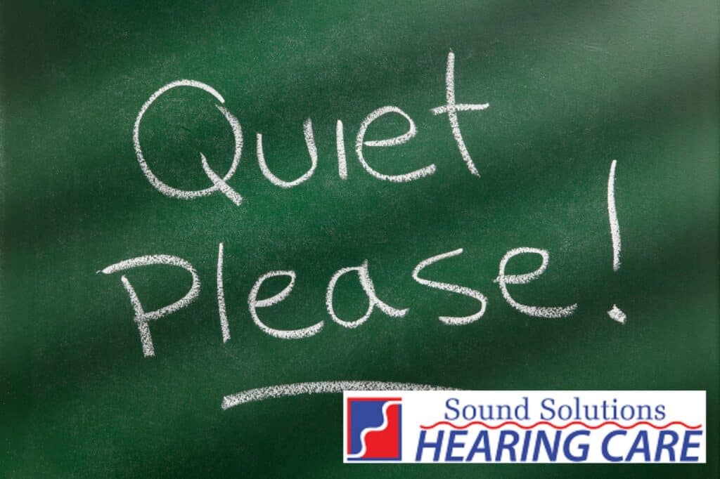 the words quiet please written on a blackboard