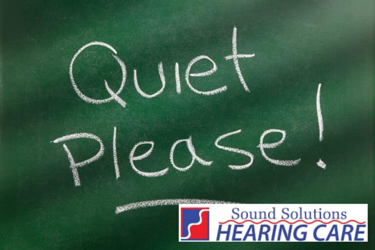 the words quiet please written on a blackboard