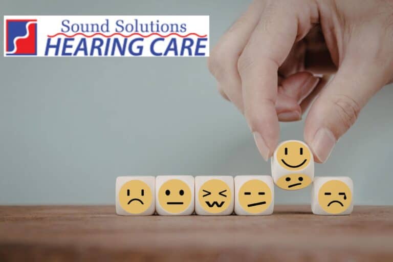 wooden blocks with different smiley faces on stickers